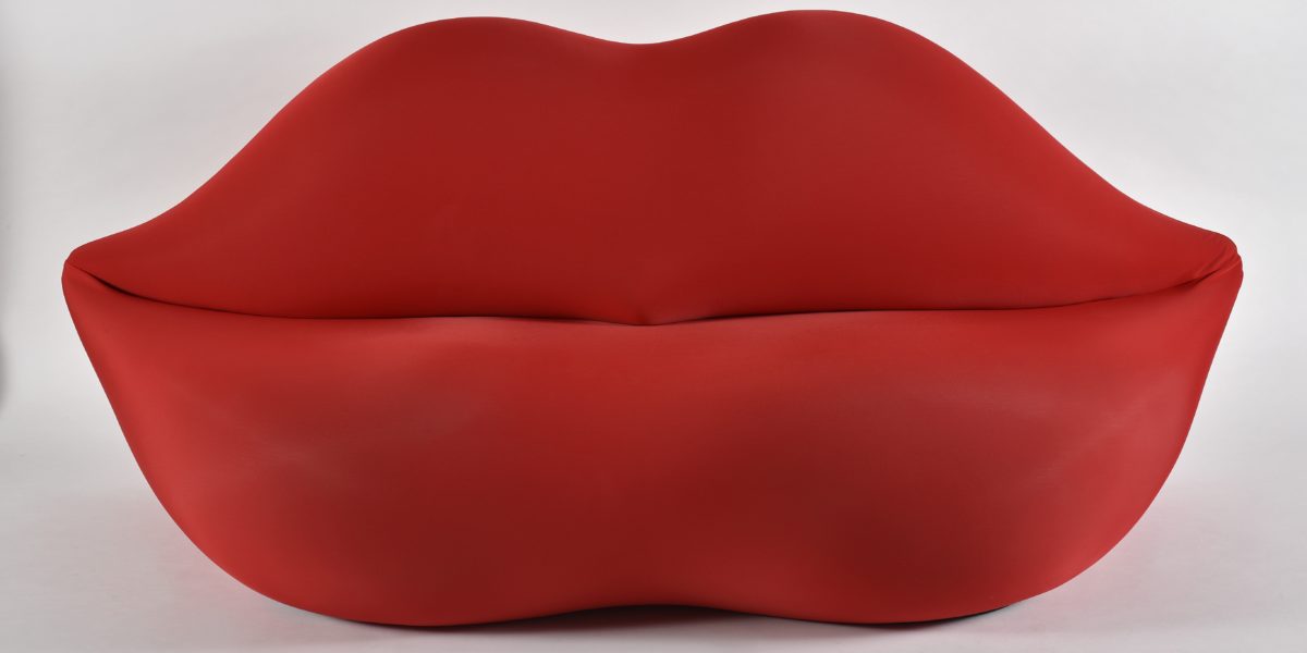 This is a picture of a sofa that looks like red lips. It is the Bocca Sofa, made by Studio65